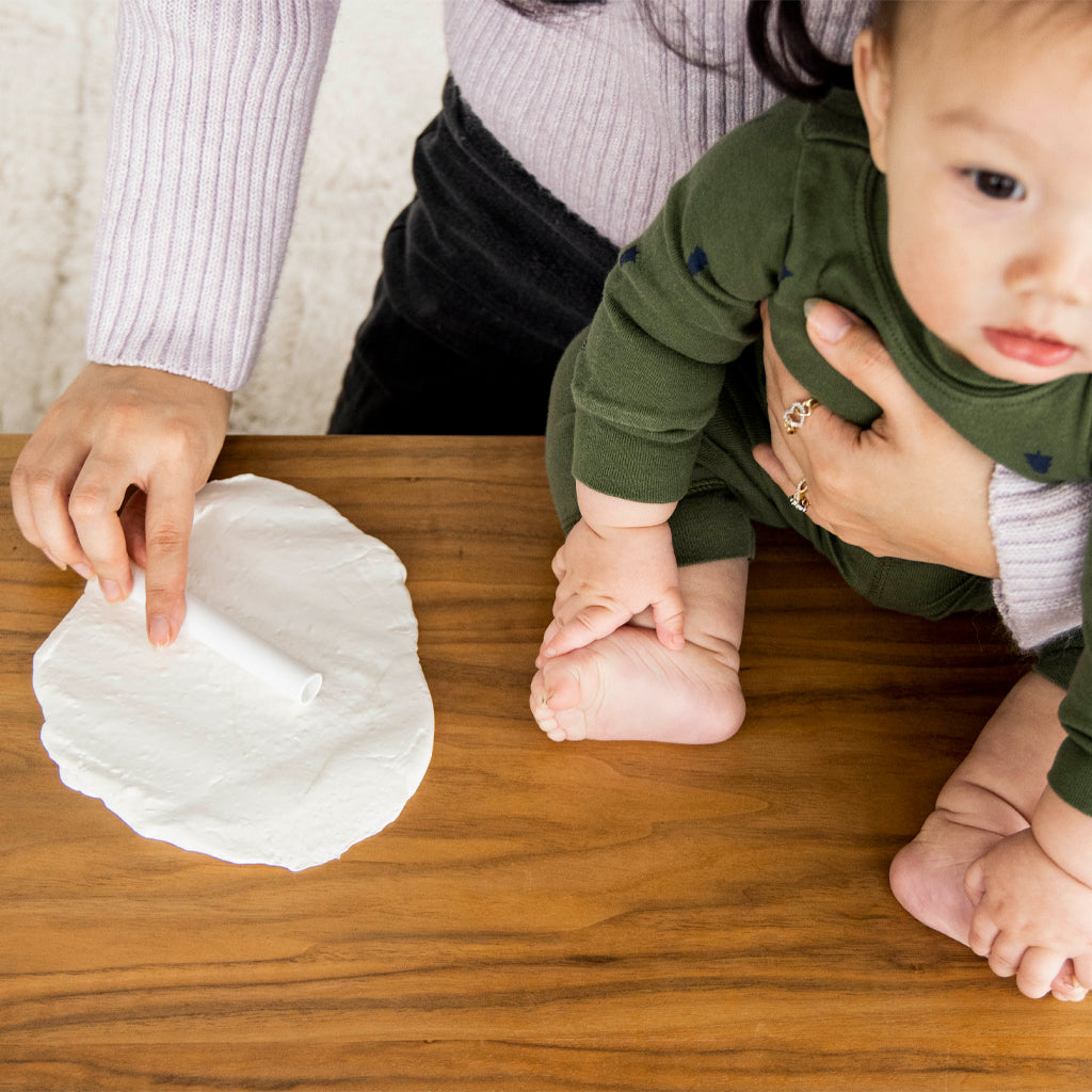 Rolling out the babyprints keepsake.